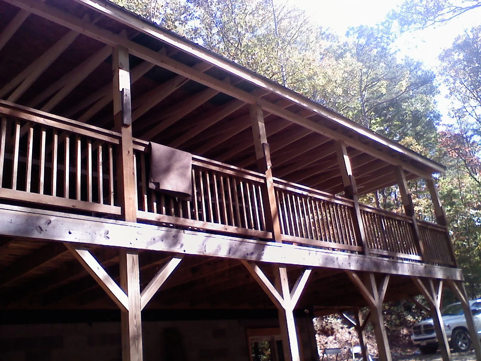 Timber framing under a new elevated porch and deck — Roof Leak Repair in Port Jefferson by Roofing Brothers